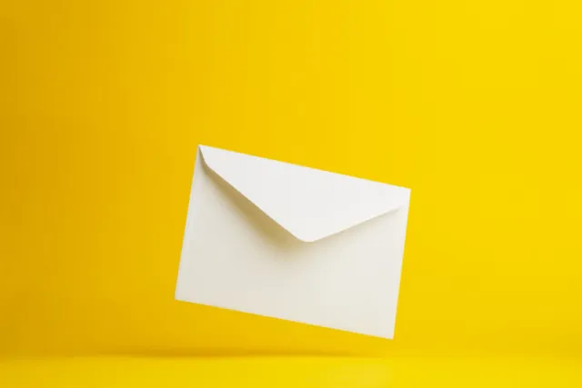 An envelope against a yellow background