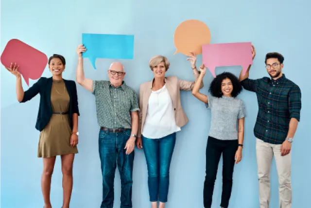 Five people hold up different coloured and shaped speech bubbles