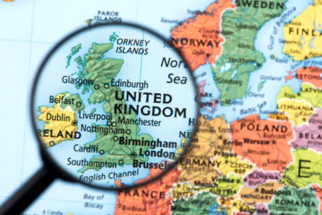 A magnifying glass over a map of the UK